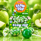 Pile of Sour Apple Blow Pops in green wrappers