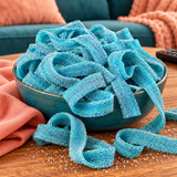 Close-up of Blue Raspberry Sour Belts showing the sour sugar coating on blue raspberry candy belts