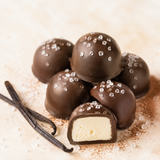 Dark chocolate caramel cut open to show the center