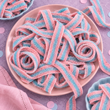 Pile of cotton candy sour candy belts for parties and candy buffets