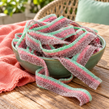 Close-up of Watermelon Sour Belts showing the sour sugar coating on watermelon candy belts
