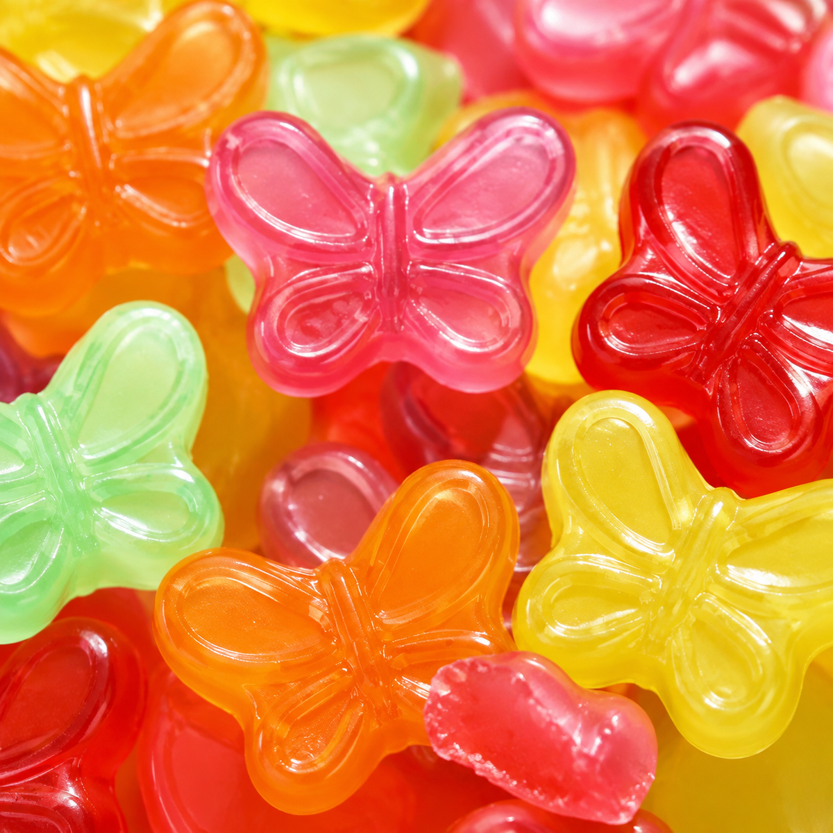 Colorful gummy butterflies candy in six fruit flavors