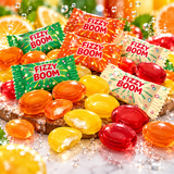 Fizzy Boom fruit hard candies in orange, yellow, red and green
