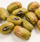 Roasted edamame scattered on a light surface
