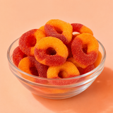 Close-up of a chamoy-coated peach ring