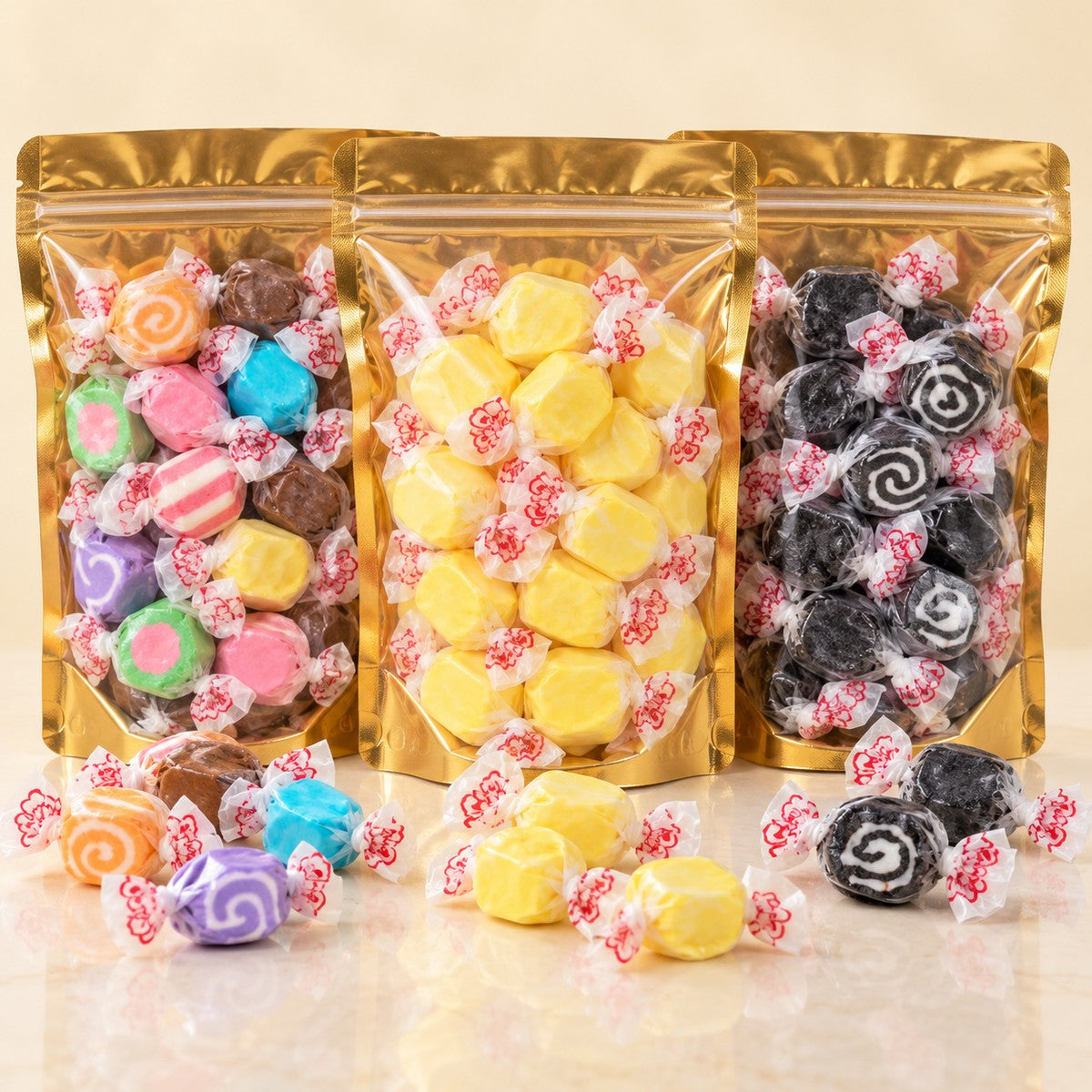 Three pouches of salt water taffy: assorted, banana and black licorice swirl
